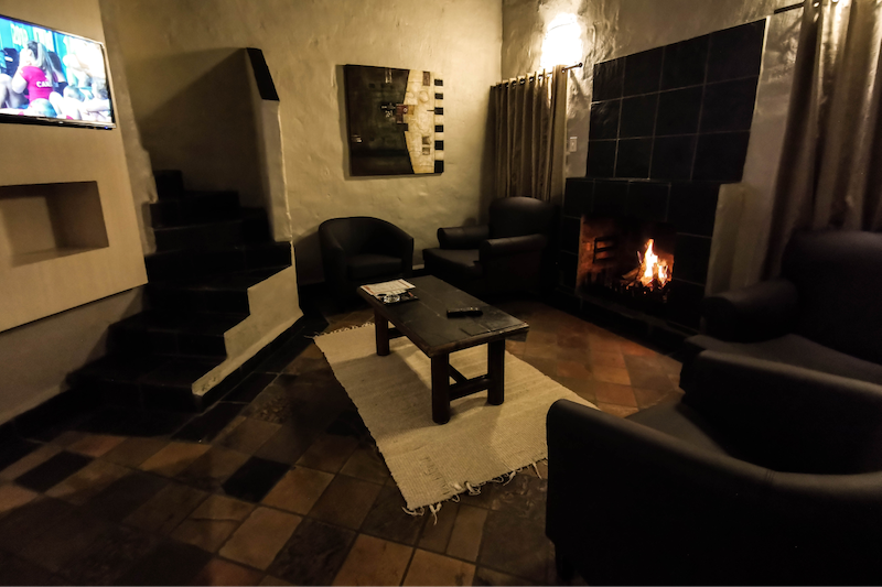 Umuzi Lodge Accommodation 6 Sleeper - Lounge with fireplace