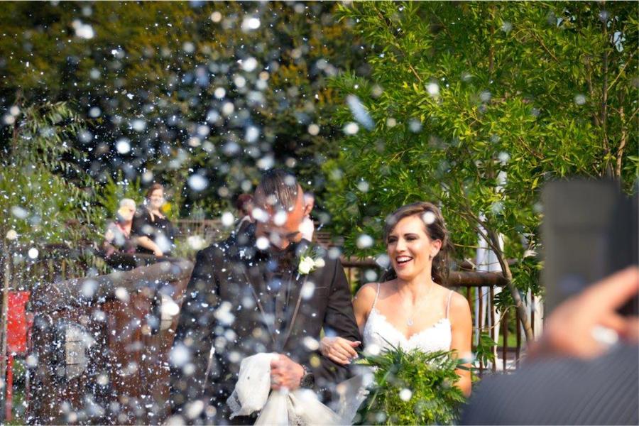 Couple being showered with confetti